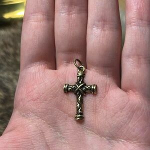 Vintage brass cross pendant with swirls and central criss-cross